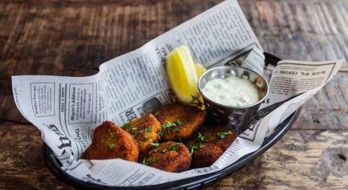 Why should food not be wrapped in newspaper?  