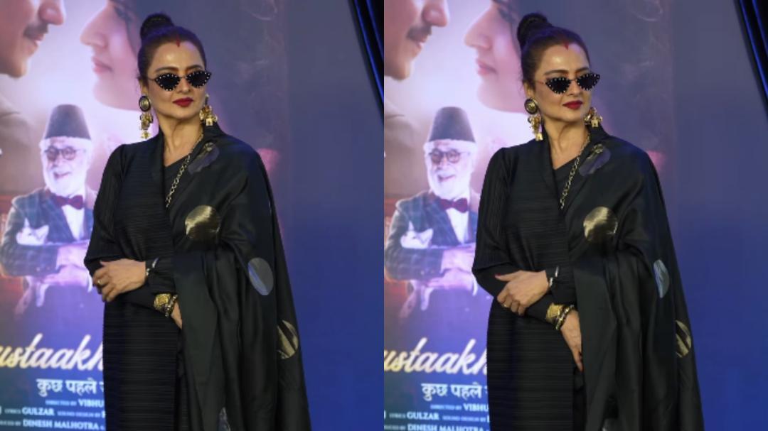 Rekha styles saree with a coat and bold sindoor at movie screening