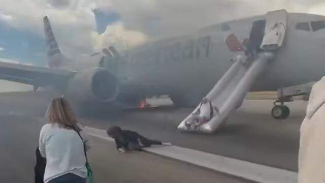 Plane catches fire on runway, video shows flyers exiting via slides in US