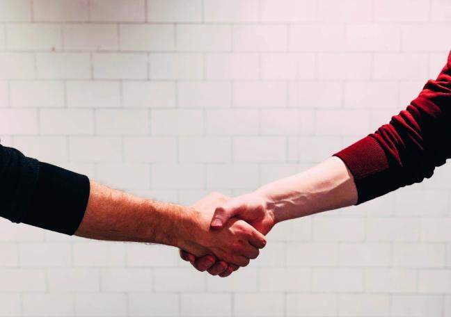How can partnerships amplify reach in consumer sectors?